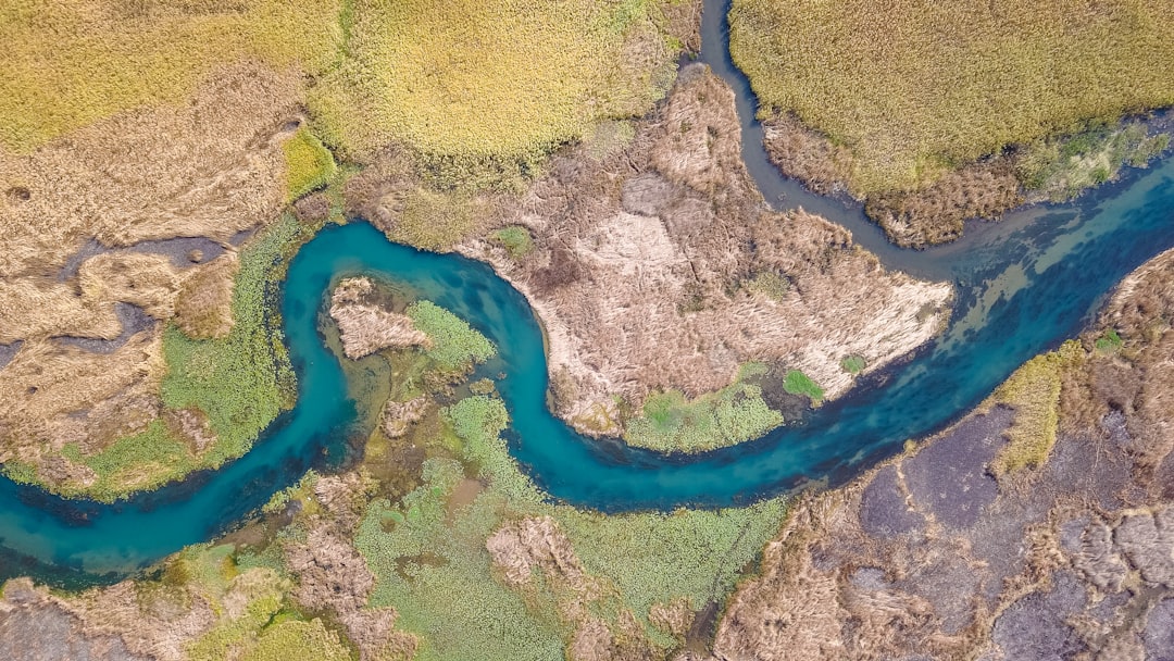 Why Rivers Curve