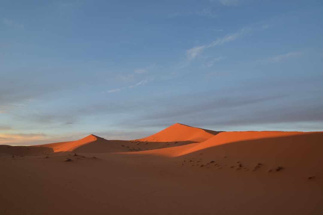 Why Sand Dunes Sing